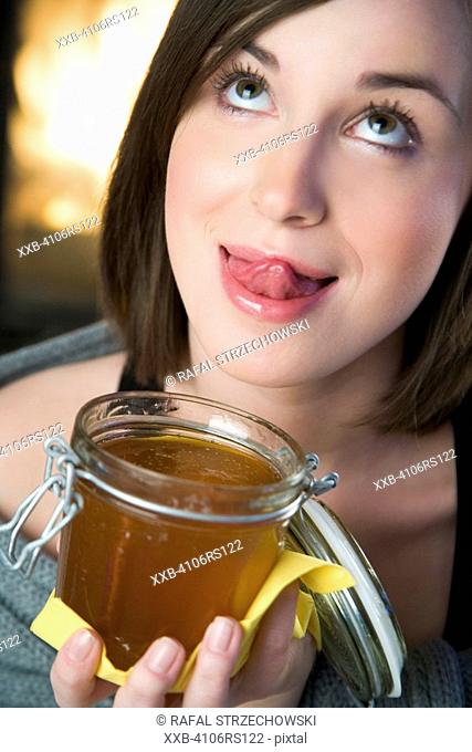 woman eating honey