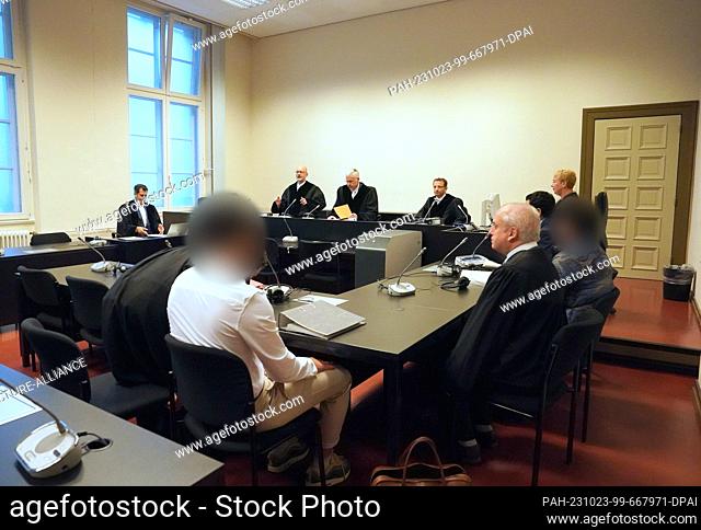 23 October 2023, Hamburg: The accused Syrian brothers (3rd from left and r) sit next to their lawyers in the courtroom in the Criminal Justice Building at the...