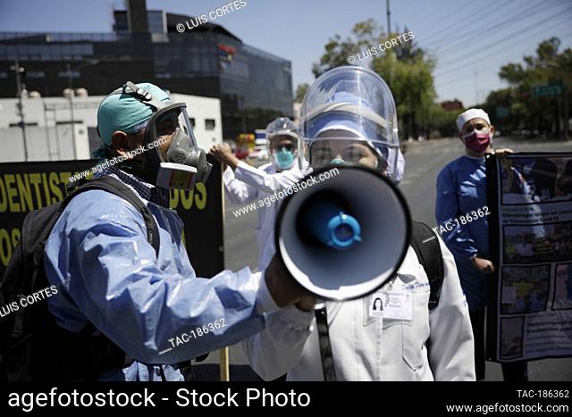 MEXICO CITY, MEXICO - MARCH 24: A dentist, takes part during a protest to demand Covid-19 vaccine, due they not are received yet a dose to immunized against the...