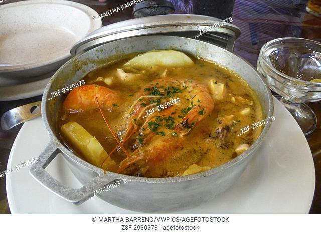 The ''Calderada'', a soup of seafood and potatoes, is cooked and served in a cauldron. Olon beach. Ecuador