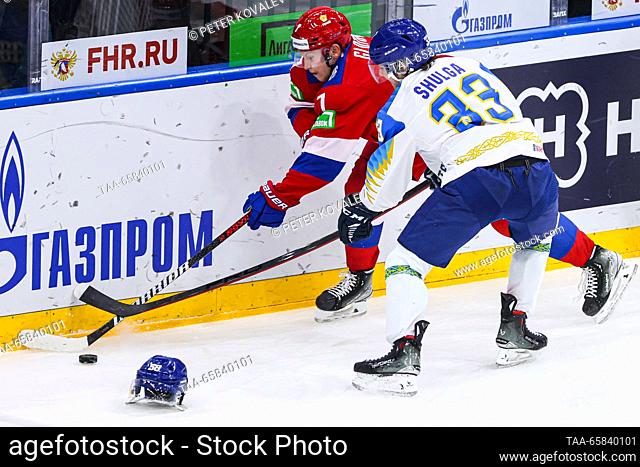 RUSSIA, ST PETERSBURG - DECEMBER 17, 2023: Russia 25's Vasily Glotov (L) and Kazakhstan's Nikolai Shulga in action in their 2023 Channel One Cup ice hockey...