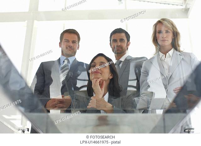 Business team looking through a glass