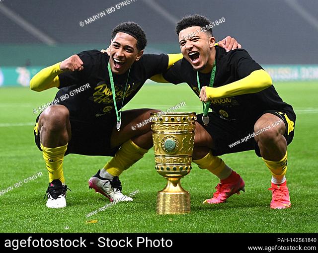 final jubilation after the end of the game at Cup Winner 2021 BVB: Jude Bellingham (BVB) and Jadon Sancho (BVB) / r with Pokal, DFB-Pokal, Siegerpokal, Trophaee