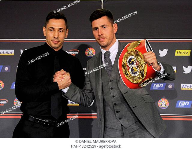 Challenger Felix Sturm (L) and the IBF middleweight world champion Darren Barker from Great Britain pose during a press conference in Stuttgart, Germany