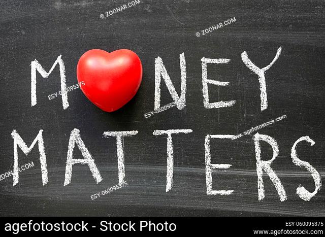 money matters phrase handwritten on blackboard