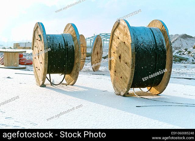 coils with electric cable, wooden bobbin for cable winding