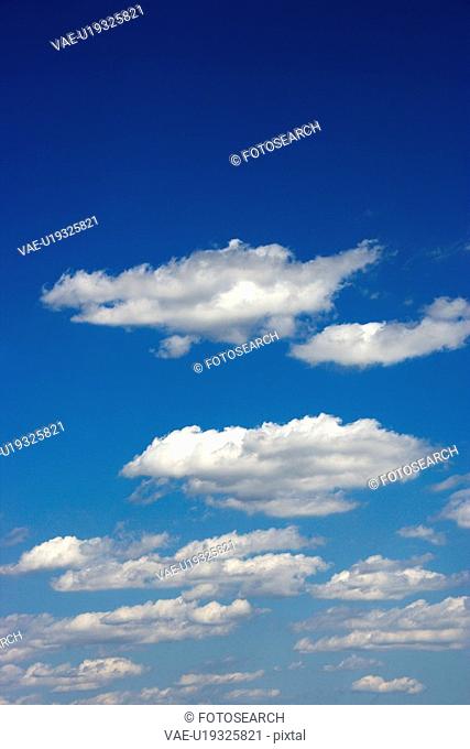 Fluffy clouds in blue sky