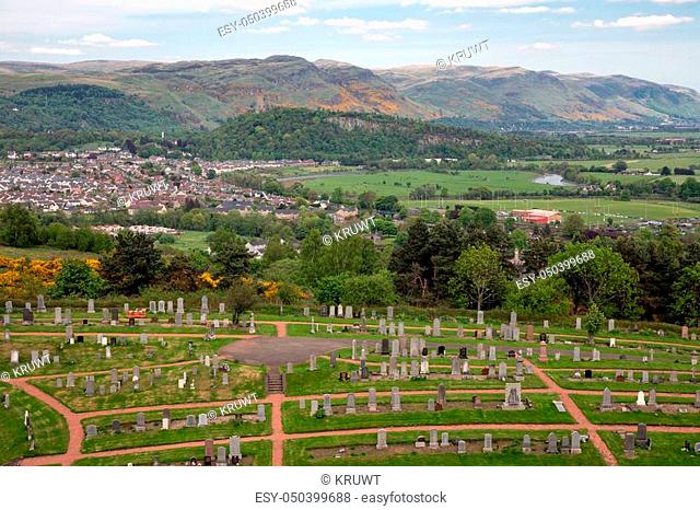 Aerial view from Scottish Stirling Castle at town of Stirling with graveyard and in the background the Wallace monument near the hills