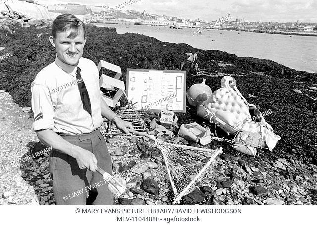 RAF Survival School, Plymouth, where air crew are taught how to survive after ditching their aircraft. Seen here is a man on the seashore with a display of...