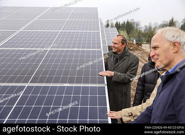 25 April 2022, Saxony, Zwickau: Wolfram Günther (The Greens), Saxony's energy and climate protection minister, stands in a new solar park