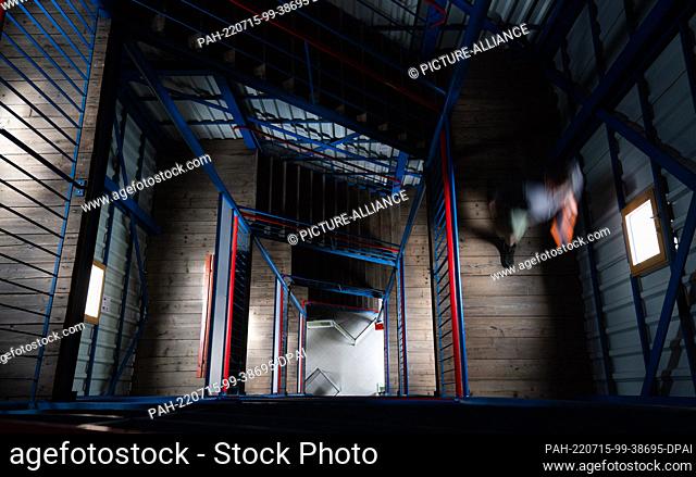 15 July 2022, Bavaria, Ludwigsstadt: A man walks down the stairs of the Thüringer Warte observation tower. Photo: Nicolas Armer/dpa