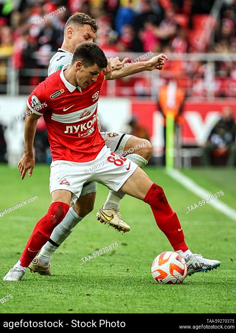 RUSSIA, MOSCOW - MAY 21, 2023: Spartak Moscow's Daniil Khlusevich (front) and CSKA Moscow's Fyodor Chalov in a 2022/2023 Russian Premier League Round 28...