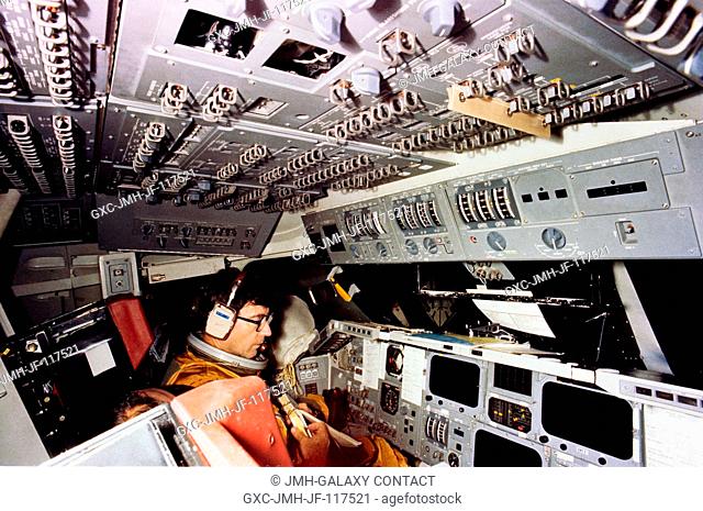 Astronaut John W. Young, commander of STS-1, goes through a simulation exercises in the shuttle mission simulator (SMS) in the mission simulation and training...