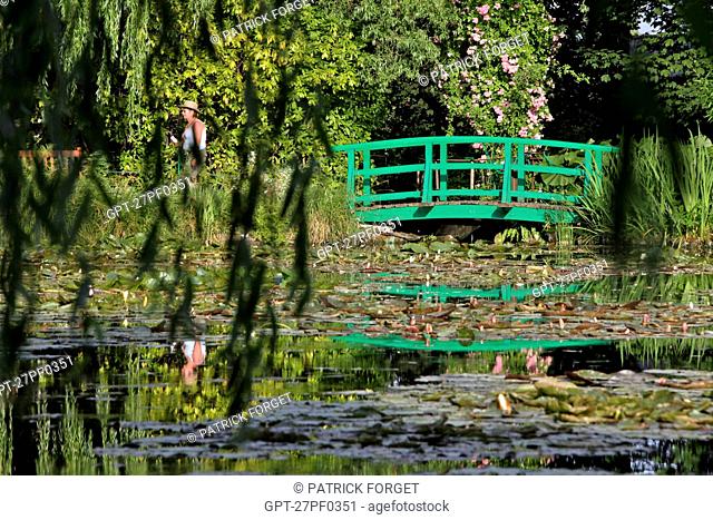 JAPANESE BRIDGE AND THE WHITE WATER LILY POND IN THE IMPRESSIONIST PAINTER CLAUDE MONET'S WATER GARDEN, GIVERNY, EURE 27, FRANCE