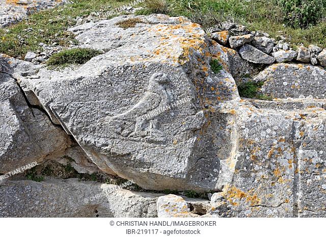 Stone relief of an eagle (Zeus) at the sacred site of Artemidoros, Thira, Santorini, Greece