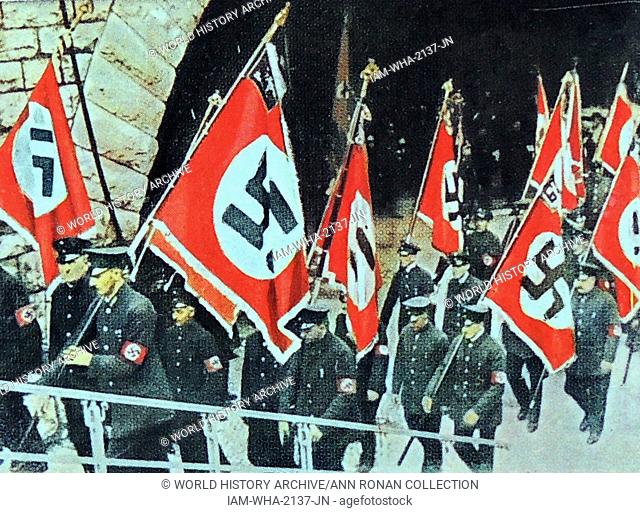 banners carried by a Nazi uniformed unit circa 1933