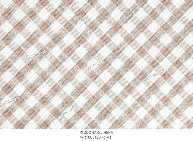 Beige checkered fabric. Tablecloth texture