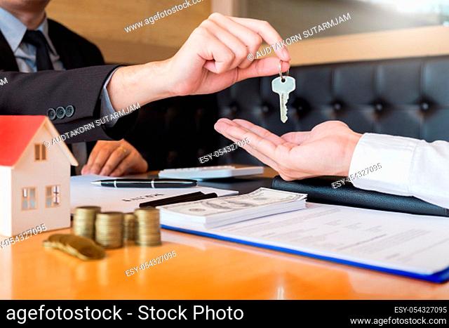 estate agent giving house keys customer sign agreement property for sale, Buying and selling homes concept