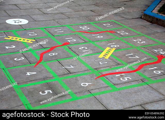 classic children game with numbers painted on the school playground floor