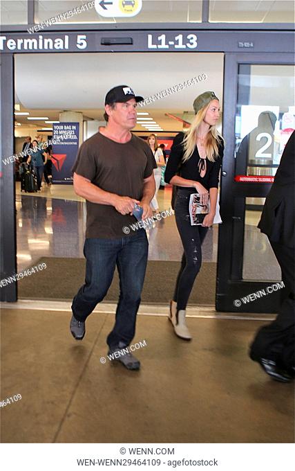 Josh Brolin holds hands with fiance Kathryn Boyd as they arrive at Los Angeles International Airport Featuring: Josh Brolin, Kathryn Boyd Where: Los Angeles