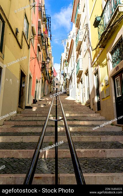 Lisbon, Portugal - 15 December 2020: stairs leading up a narrow alley in the historic city center of Lisbon