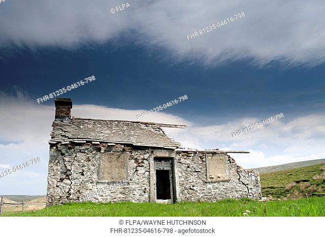 Abandoned shooting lodge on roadside of B6255 from Hawes to Ingleton, North Yorkshire, England, May