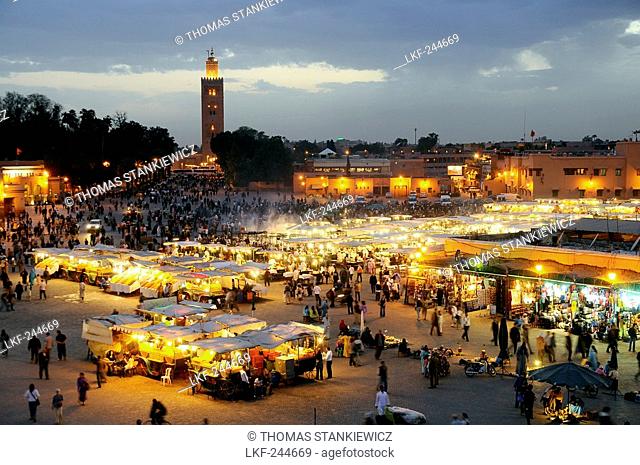Illuminated snack stalls at the Place Jemaa el-Fna in the evening, Marrakesh, South Morocco, Morocco, Africa