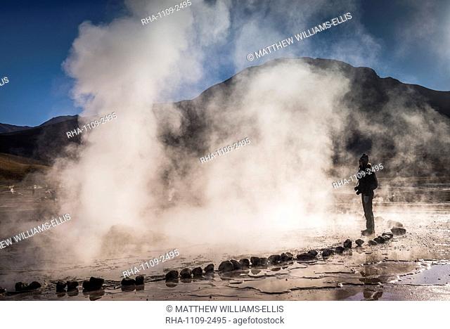 Tourist at El Tatio Geysers (Geysers del Tatio), the largest geyser field in the Southern Hemisphere, Atacama Desert, Chile, South America
