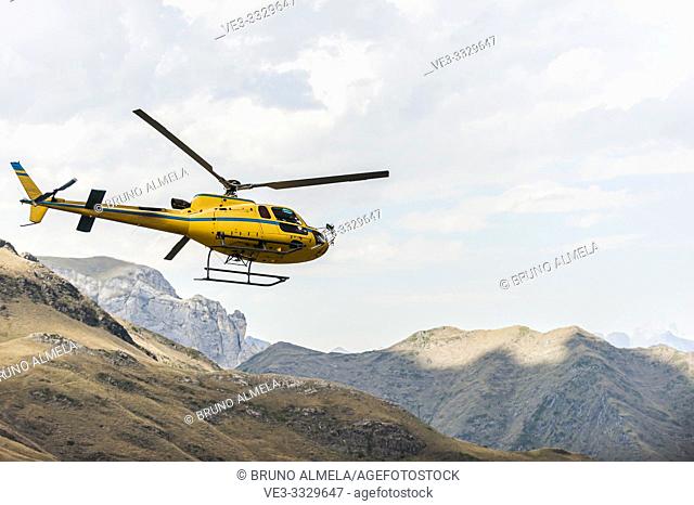 Helicopter flying in Pyrenees national Park (Hautes-Pyrénées Department, Nouvelle-Aquitaine Region, France)