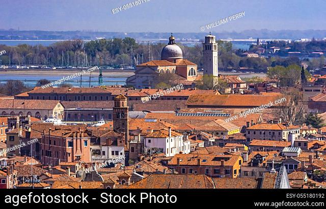 Beautiful orange roofs and neighborhoods, houses and churches in Venice Italy
