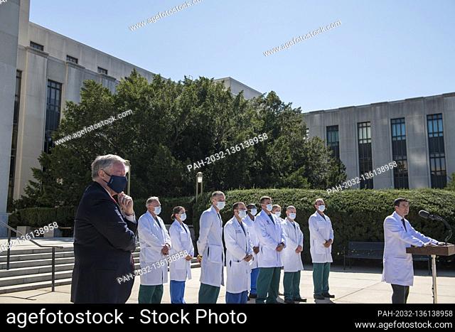 White House Chief of Staff Mark Meadows, left, listens while CDR Sean P. Conley, MD, Physician to the President, provides an update on the condition of United...