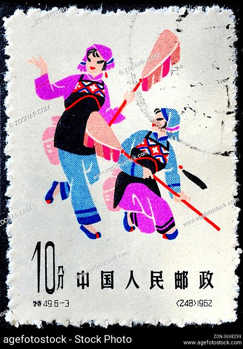 CHINA - CIRCA 1962: A Stamp printed in China shows image of two dancing girls, circa 1962 CHINA - CIRCA 1962: A Stamp printed in China shows image of two...