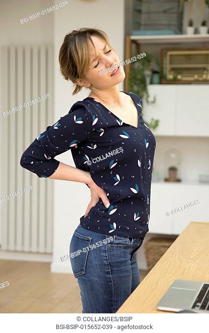 Woman suffering from lumbar pain