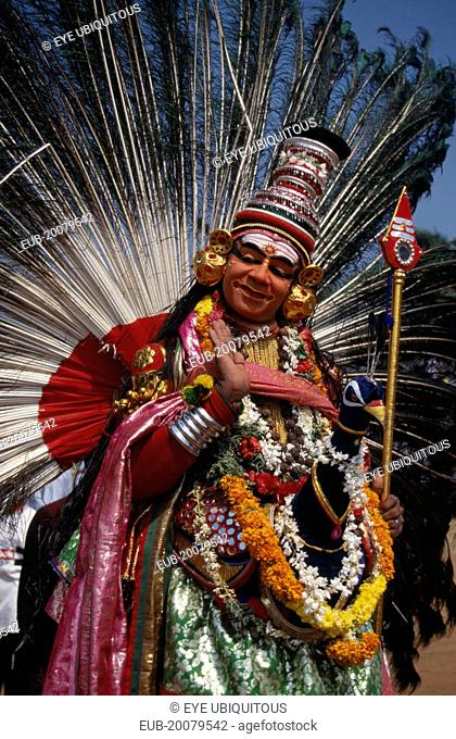 Mayura Nritham, Peacock Dance, dancer in costume and painted face, at The Great Elephant March festival