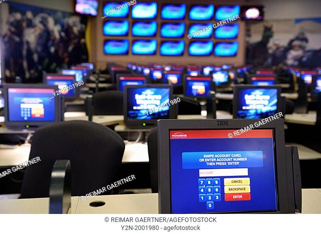 Computer screens for self-serve wagering on horse races at Woodbine Racetrack Toronto
