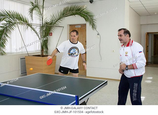 Taking time out from training, Expedition 33 Flight Engineer Kevin Ford of NASA (left) and backup Soyuz Commander Pavel Vinogradov play a game of ping-pong at...
