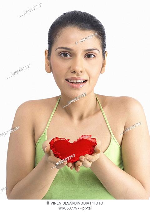 Girl holding heart on hand palm MR