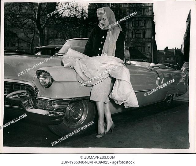 Apr. 04, 1956 - Diana Dors Chosses Dress length to match her car: Photo shows Stage and Screen star Diana Dors matches a dress length - with her Cadillac car -...
