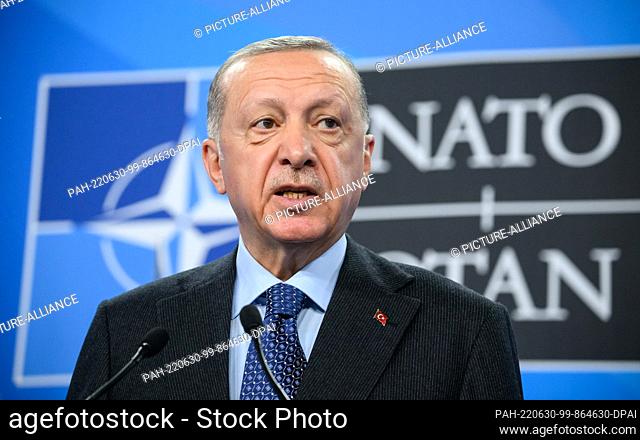 30 June 2022, Spain, Madrid: Recep Tayyip Erdogan, President of Turkey, speaks at a press conference at the end of the NATO summit in Madrid