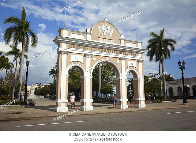 Tourists in front of the Arch Of Triumph-Arco Del Triunfo at Parque Jose Marti in Plaza de Armas Square, Cienfuegos, Cuba, West Indies, Central America