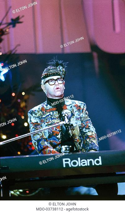 British singer-songwriter Elton John (Reginald Kenneth Dwight) attending as guest the television program Telemike playing the player piano and singing