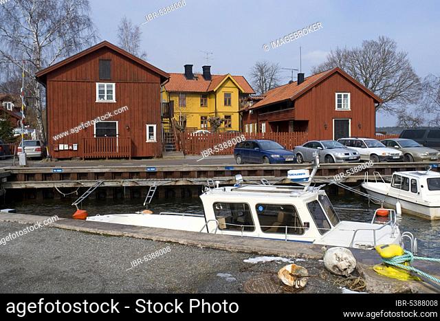 Wooden houses and boats, archipelago island Vaxholm, Sweden, motor boats, Europe