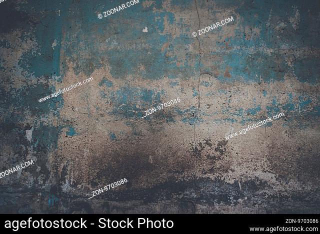 Grunge wall background with weathered paint and crack