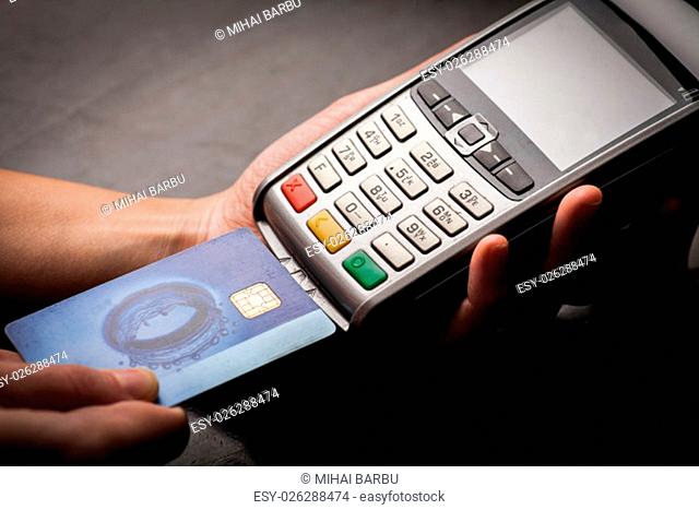Color image of a POS and credit cards