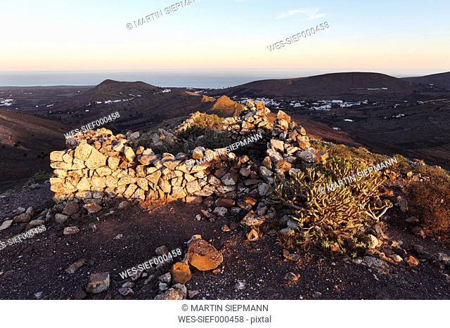 Spain, Canary Islands, Lanzarote, Haria, Risco de Famara, View of top of matos verdes mountain at dusk