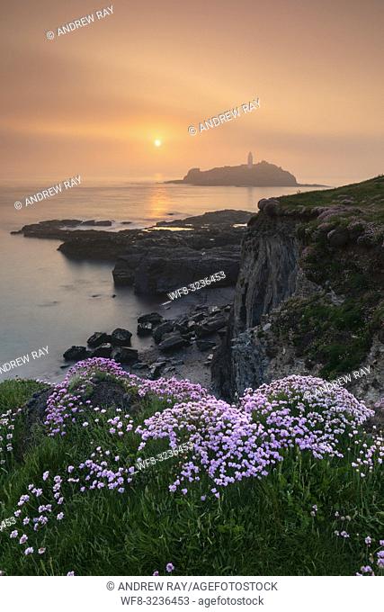 Godrevy Lighthouse on the North Coast of Cornwall captured shortly before sunset on a misty evening in May. The image was carefully composed to include the...