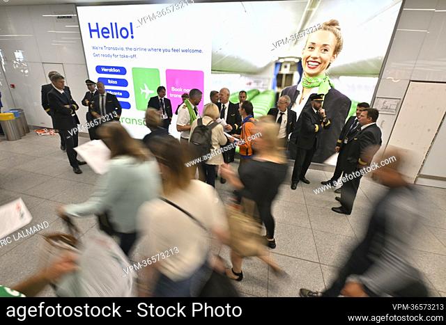 Illustration shows workers on strike and travelers in the departure hall of Brussels Airport, in Zaventem, Thursday 23 June 2022