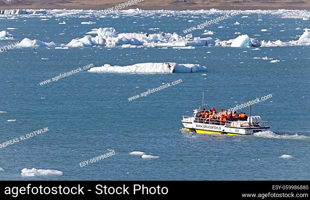 JOKULSARLON, ICELAND - JULY 30, 2021: Jokulsarlon Glacial Lagoon Boat Tour in Iceland. Many people visit the famous glacial lagoon in Iceland every year