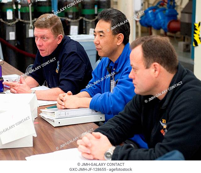 NASA astronaut Mike Fossum (left), Expedition 28 flight engineer and Expedition 29 commander; Japan Aerospace Exploration Agency (JAXA) astronaut Satoshi...