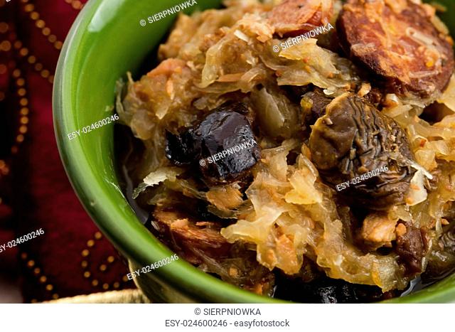 traditional polish sauerkraut (bigos) with mushrooms and plums for christmas